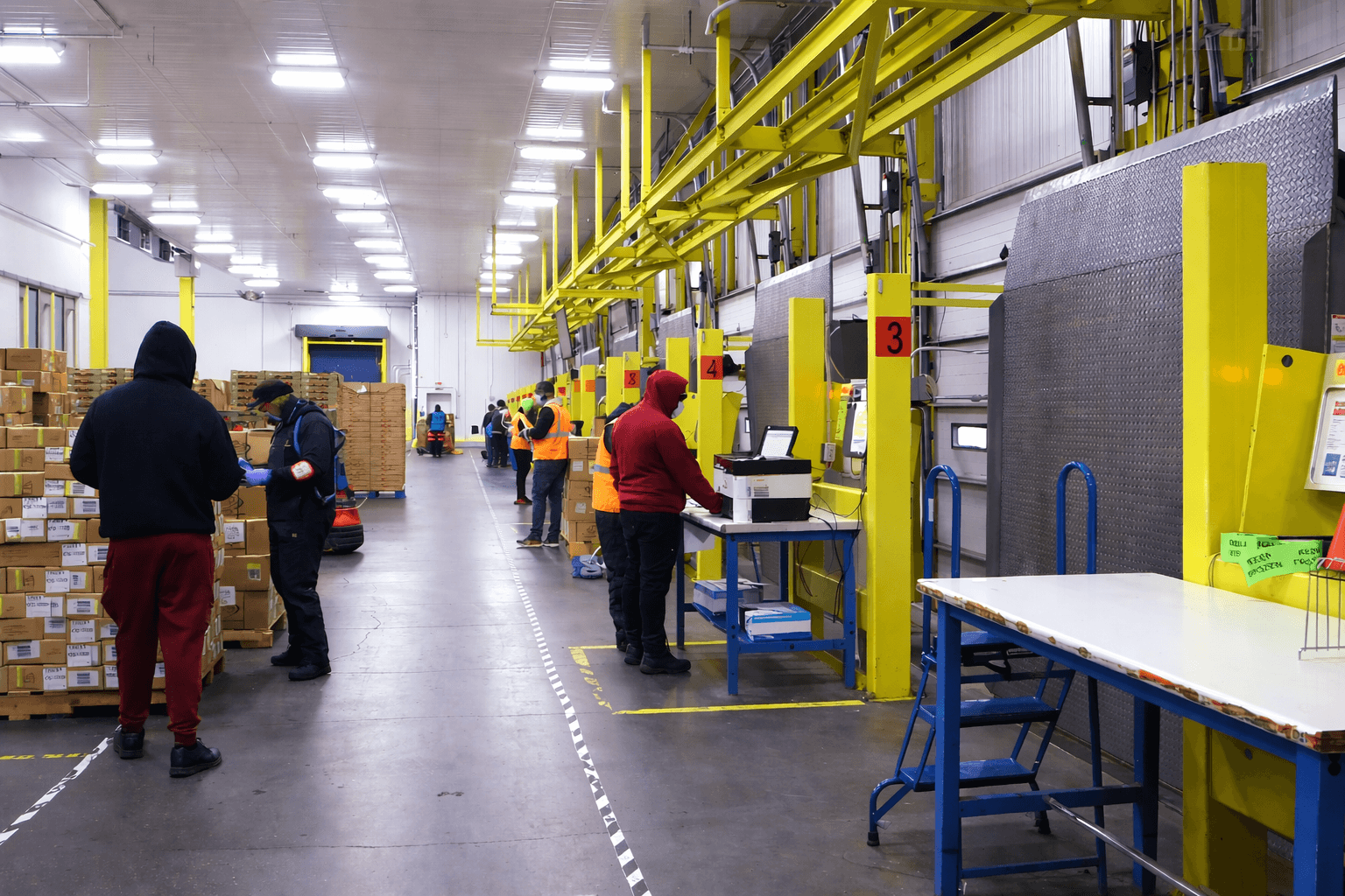 Warehouse workers sorting packages
